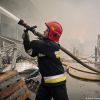 Наслідки нічної атаки військ РФ: в Києві пошкоджена гімназія, в області палають склади